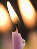 Closeup of lit candles Photographic Print