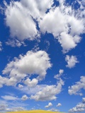 Beautiful Cumulus Clouds and Golden Prairie Photographic Print by John Eastcott & Yva Momatiuk