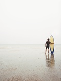 Man with surfboard Photographic Print by Tomas Rodriguez