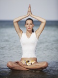 Woman meditating in the ocean Photographic Print by Olivier Cadeaux