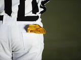 Referee with Penalty Flag in Pocket Photographic Print by Robert Michael