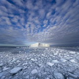 Blue Tabular Iceberg Sculpted by Waves Photographic Print by John and Yva Eastcott And Momatiuk