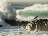 Surf Crashing near Surfer on Boulders Photographic Print by Mark A. Johnson