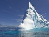 Pointy Blue Iceberg Sculpted by Waves Photographic Print by John Eastcott & Yva Momatiuk