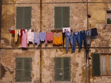 Laundry Hanging Outside Windows Photographic Print by Steven Vidler