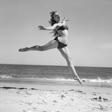 1950S Woman in Bikini Running and Jumping on the Beach Smiling Photographic Print by H. Armstrong Roberts