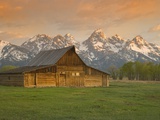 Log Barn in Meadow near Mountain Range Photographic Print by Jeff Vanuga