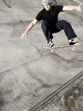 Skateboarder Performing Tricks Photographic Print