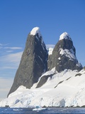 Snowcapped Pinnacles Rising from Coast Photographic Print by John and Yva Eastcott And Momatiuk
