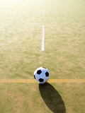 Football on astroturf field Photographic Print