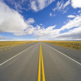Rural Road Through Grassland Photographic Print by John Eastcott & Yva Momatiuk