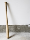 Detail of wooden baseball bat against white and concrete wall. - Fotografik Baskı