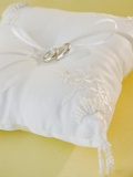 Wedding rings on pillow Photographic Print by Jamie Grill