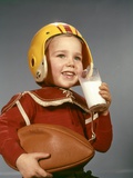 1950s 1960s Boy Drinking Glass Milk Wearing Football Helmet Shoulder Pads Photographic Print by H. Armstrong Roberts