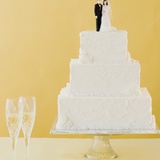 Wedding cake toppers on cake Photographic Print by Jamie Grill