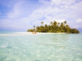 Sea kayaks on the beach of a coconut palm tree island Photographic Print by Frank Lukasseck