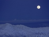 Moonrise over Glacier National Park from The Big Mountain ski area Photographic Print by Gordon Wiltsie