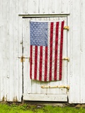 American flag draped,door of barn Photographic Print