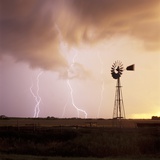 Lightning Striking Amid Farmland Photographic Print by Eric Swanson