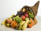 Fruits and vegetables in cornucopia basket Photographic Print