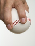 Close up of pitcher holding baseball Photographie