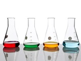 Four conical flasks holding different colored fluids Lámina fotográfica por Antenna