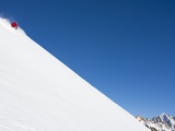 Backcountry skier on mountain Fotografisk tryk af John Norris