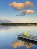 Clouds reflected in Silent Lake with Muskoka chair on dock Photographic Print by Mike Grandmaison