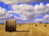 Bales and Clouds Near Sherbrooke, Saskatchewan, Canada. Photographic Print by Mike Grandmaison