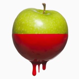 Apple dripping with color Photographic Print by Mike Kemp