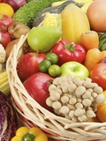Stack of different kinds of fruits and vegetables in a basket Photographic Print