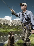Man fly fishing with dog Fotografisk trykk av Brian Bailey