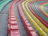 Rows of Colorful Seats in Empty Stadium Photographic Print by Paul Gun