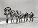 Women Holding Giant Masks Photographic Print by Bettmann 