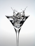 Wineglass of splashing water Photographic Print