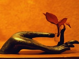 Sculpted Hand Holding Massage Oil Vial Photographie par Dave Bartruff