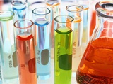 Test Tubes of Colored Liquid Fotografie-Druck von Mark Karrass