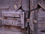Chains and Lock on Weathered Barn Door Photographic Print by Mick Roessler