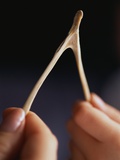 Two hands and a Wish Bone Photographic Print by Philip James Corwin
