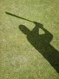 Shadow of Baseball Player Swinging Bat Impressão fotográfica por Randy Faris Shadow of Baseball Player Swinging Bat Impressão fotográfica por Randy Faris