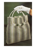 Gloved Hand Holding Net Purse, Retro Prints