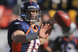 Denver Broncos and Pittsburgh Steelers: Tim Tebow Photographic Print by Chris Schneider