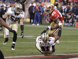 San Francisco 49ers and New Orleans Saints: Vernon Davis and Roman Harper Photographic Print by Paul Sakuma
