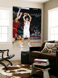 Cleveland Cavaliers v Houston Rockets: Luis Scola and Anderson Varejao Print by Bill Baptist