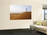 Man Standing on Sand Dune Looking Out on Arabian Desert Prints by Christian Aslund