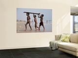 Three Boys Carrying Wooden Plank from Ocean Print by April Maciborka