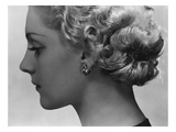 Vogue - February 1934 - Blonde Woman Wearing Spiral Clip Earrings Premium Photographic Print by George Hoyningen-Huené