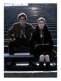 Glamour - December 1969 - Elliott Gould and Model in Stadium Premium Photographic Print by William Connors