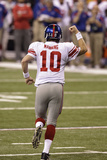 New York Giants and New England Patriots - Super Bowl XLVI - February 5, 2012: Eli Manning Photographic Print by Michael Conroy