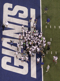New York Giants and New England Patriots - Super Bowl XLVI - February 5, 2012: New York Giants play Photographic Print by David J. Phillip